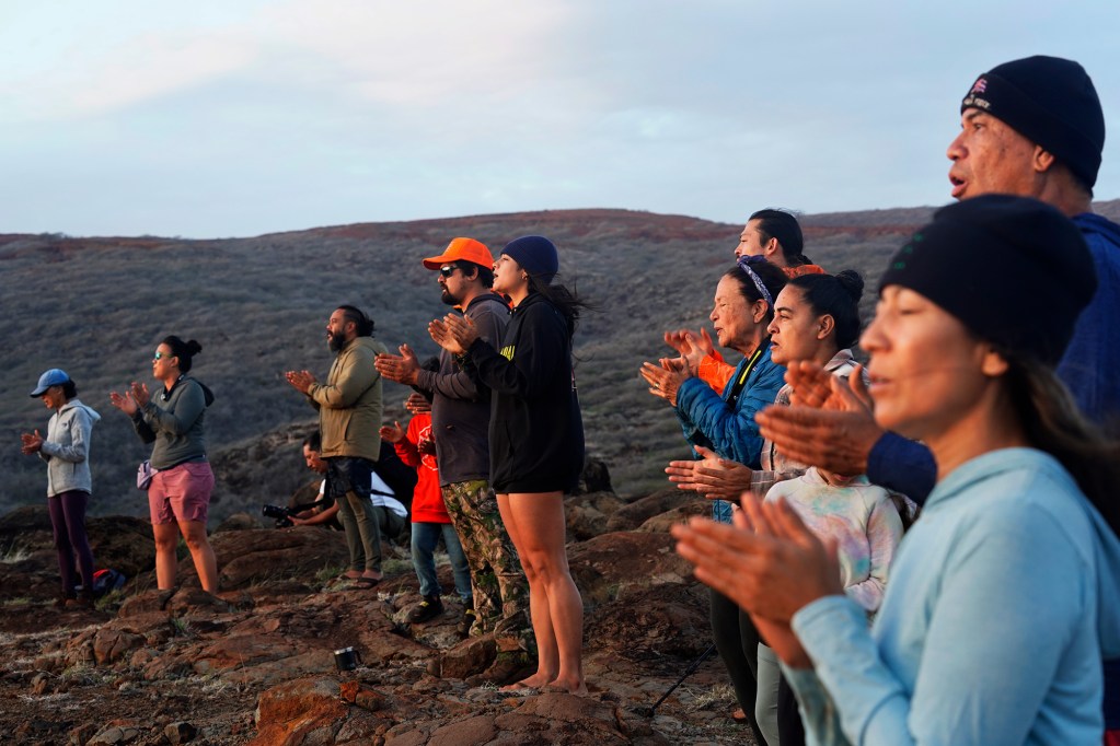 Protect Kahoʻolawe ʻOhana (PKO) chants the protocol for sunrise Tuesday, Jan. 6, 2026, in Hakioawa. PKO celebrates the 50th year of sovereign land. (Kevin Fujii/Civil Beat/2026)