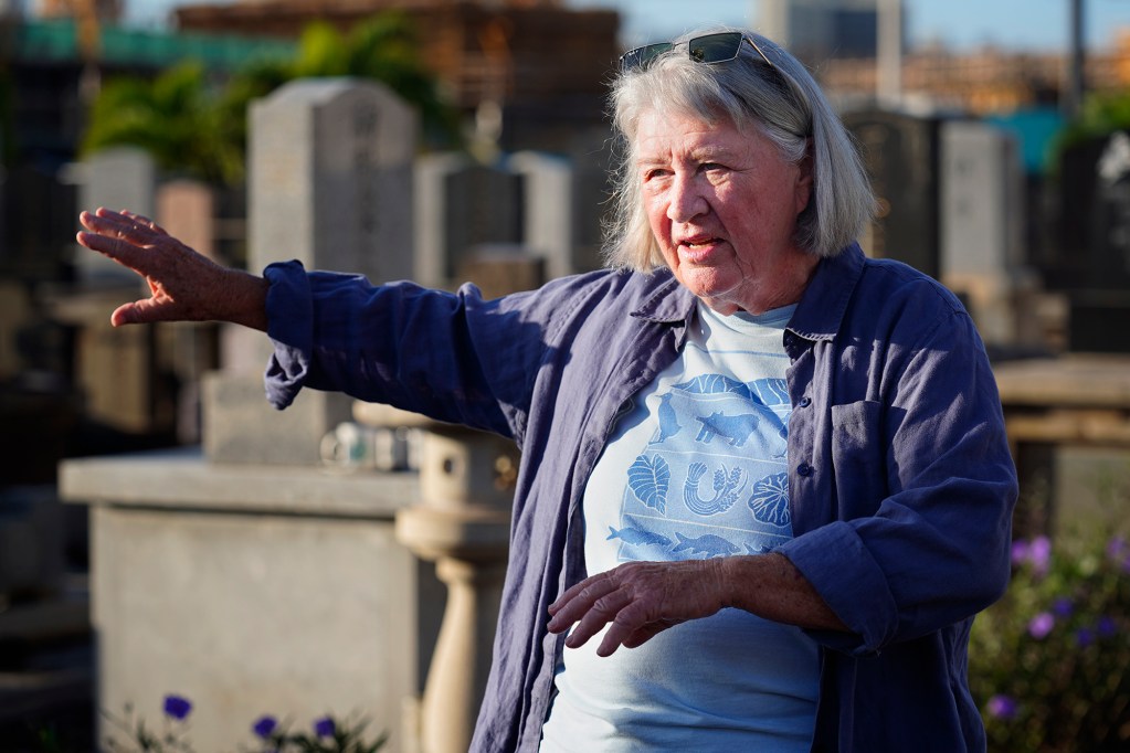 Laura Ruby is photographed at the Mōʻiliʻili Japanese Cemetery Friday, Jan. 9, 2026, in Honolulu. Ruby opposes the pedestrian bridge over the Ala Wai Canal connecting Mōʻiliʻili and Waikīkī. (Kevin Fujii/Civil Beat/2026)