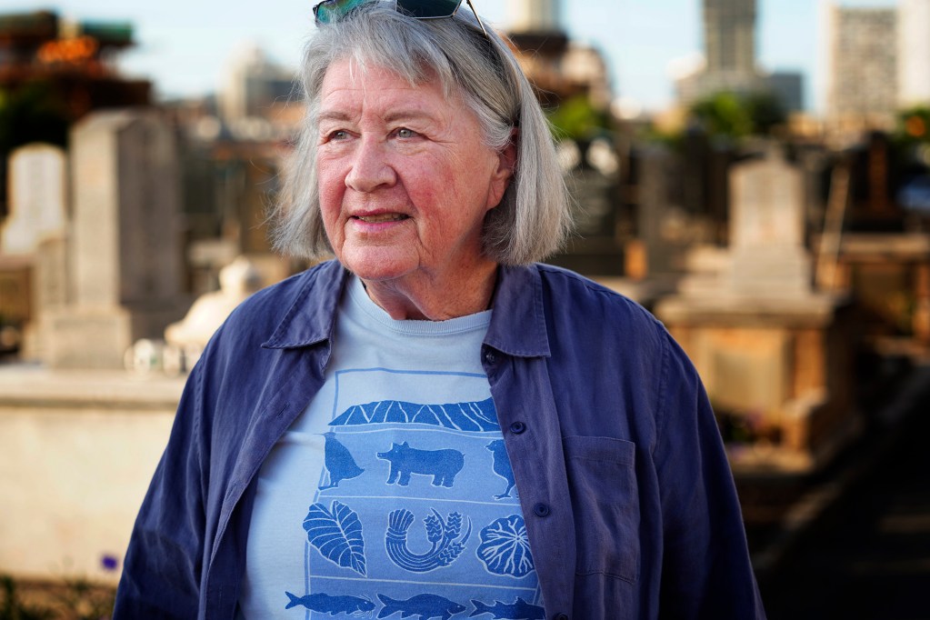 Laura Ruby is photographed at the Mōʻiliʻili Japanese Cemetery Friday, Jan. 9, 2026, in Honolulu. Ruby opposes the pedestrian bridge over the Ala Wai Canal connecting Mōʻiliʻili and Waikīkī. (Kevin Fujii/Civil Beat/2026)