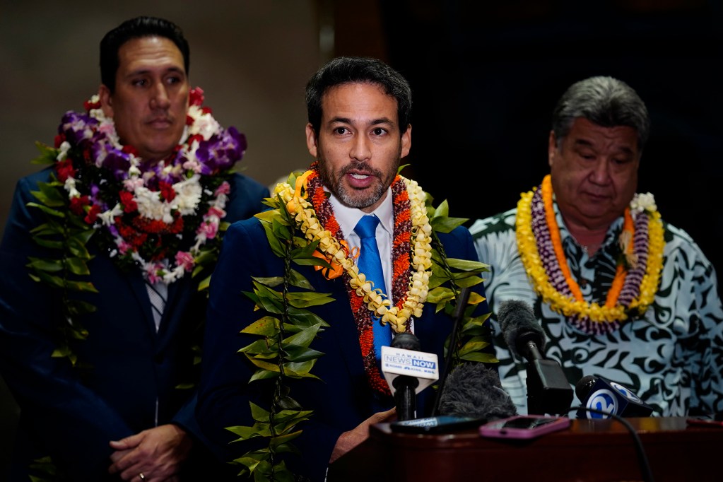 Sens. Chris Lee, center, addresses the media as Jarrett Keohokulole and Senate President Ron Kouchi look on during the post Hawaiʻi State Legislature press briefing Wednesday, Jan. 21, 2026, in Honolulu. (Kevin Fujii/Civil Beat/2026)