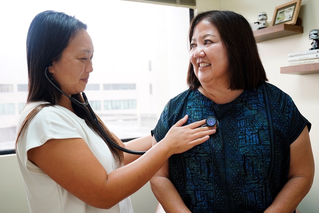 Dr. Donna Mayeda meets with patient Regina Yoshimori Monday, Feb. 2, 2026, in Honolulu. (Kevin Fujii/Civil Beat/2026)