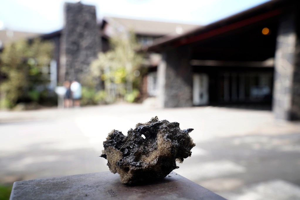 A broken strand of Pele’s hair embedded in a baseball-size tephra is photographed at the Volcano House in Hawaiʻi Volcanoes National Park after Kīlauea’s 41st episode Thursday, Feb. 5, 2026, near Volcano, Hawaiʻi Island. (Kevin Fujii/Civil Beat/2026)