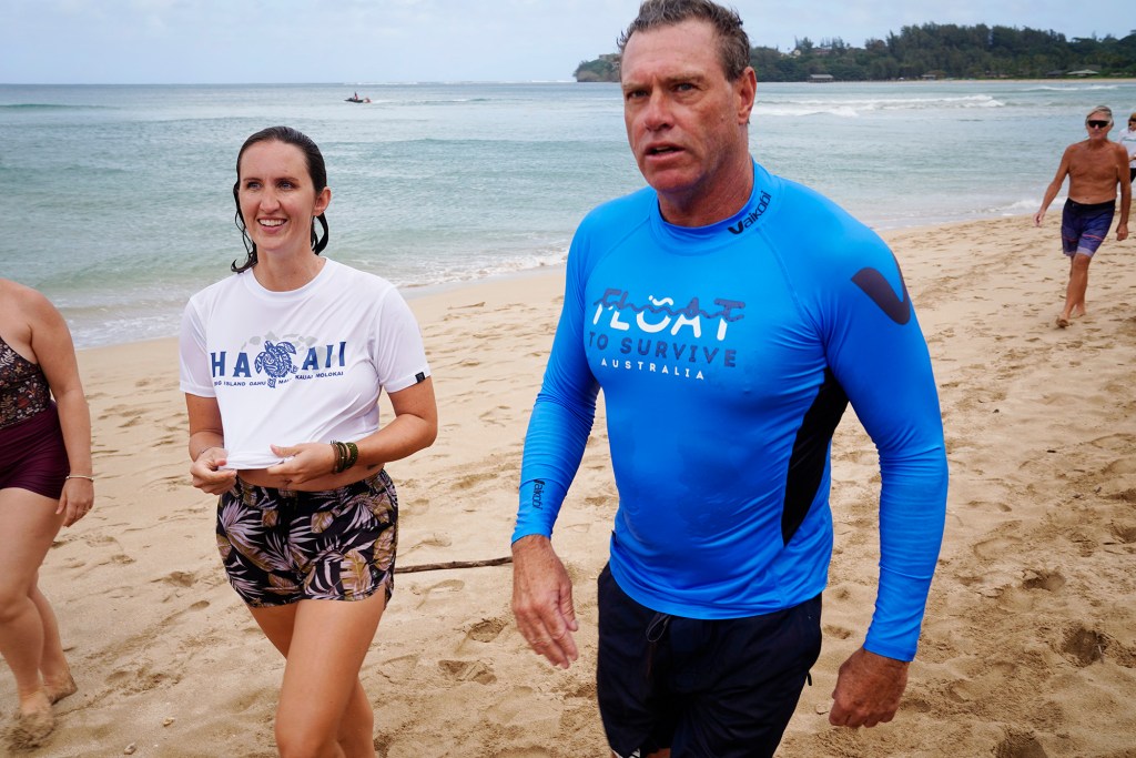 Kyla Yoder of Kapaʻa, left, and ocean safety educator Bruce “Hoppo” Hopkins of Australia, talk about her experience in Hawai‘i’s first rip current clinic at Waiʻoli Beach Park Wednesday, Feb. 18, 2026, in Hanalei. (Kevin Fujii/Civil Beat/2026)