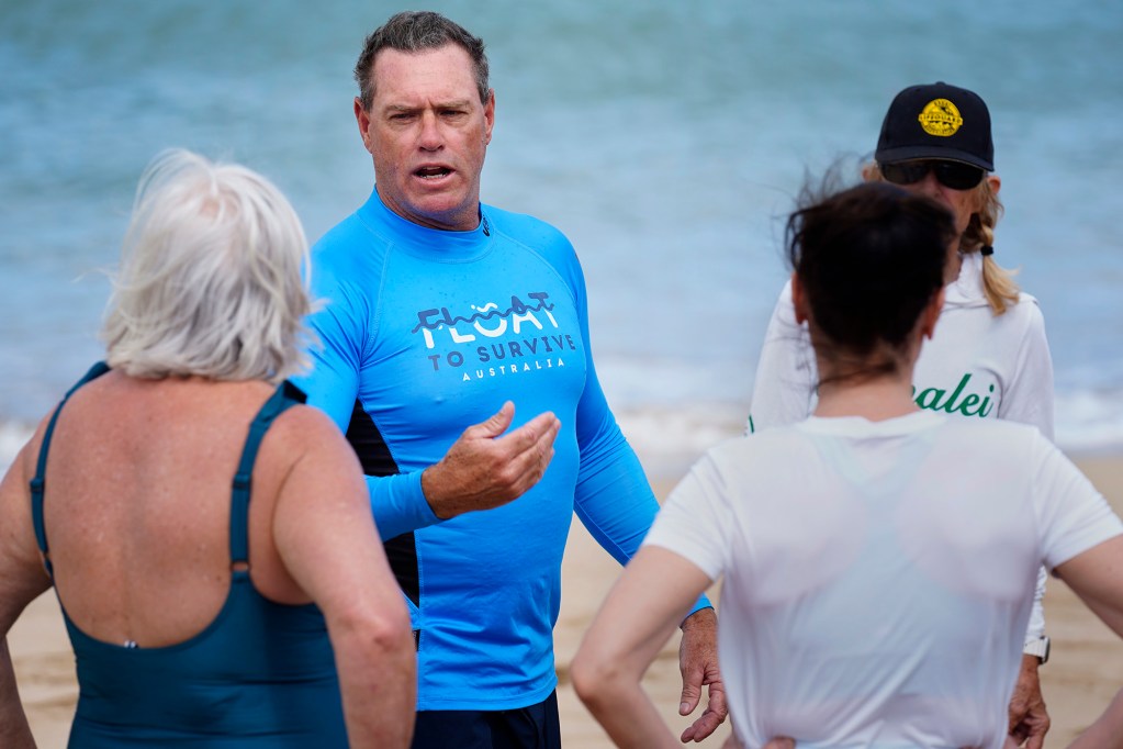 Ocean safety educator Bruce “Hoppo” Hopkins of Australia, reminds rip current clinic participants to float during the state’s first rip current clinic at Wai‘oli Beach Park Wednesday, Feb. 18, 2026, in Hanalei. The Kaua‘i Ocean Safety Bureau, Kaua‘i Lifeguard Association and the Hawaiian Lifeguard Association invited Hopkins and a group from the Okinawa Lifesaving Association to educate the public on how to work with, instead of fight, a rip current. (Kevin Fujii/Civil Beat/2026)