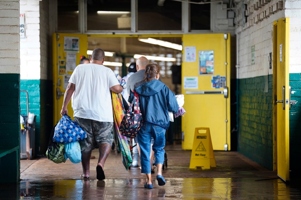North Shore residents evacuate to Leilehua High School after a Kona Low storm flooded Haleʻiwa and Waialua Friday, March 20, 2026, in Wahiawā. (Kevin Fujii/Civil Beat/2026)