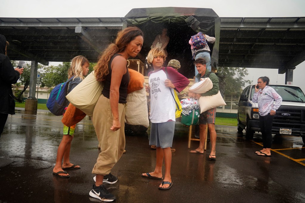 North Shore residents evacuate to Leilehua High School after a Kona Low storm flooded Haleʻiwa and Waialua Friday, March 20, 2026, in Wahiawā. (Kevin Fujii/Civil Beat/2026)
