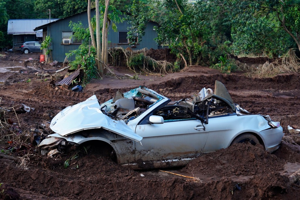 A damaged vehicle at Otake Camp is photographed Wednesday, March 25, 2026, in Waialua. The former plantation residential neighborhood received damage from the second Kona Low storm. (Kevin Fujii/Civil Beat/2026)