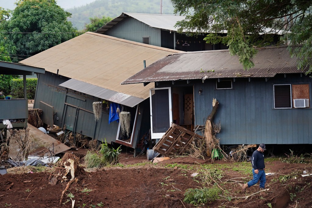 Waialua community leader Levi Rita walks near Otake Camp homes washed off their foundations Wednesday, March 25, 2026, in Waialua. The former plantation residential neighborhood received damage from the second Kona Low storm. (Kevin Fujii/Civil Beat/2026)