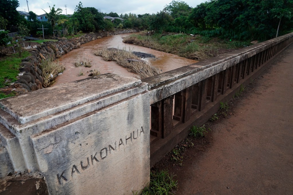 The Kaukonahua Stream flows under the Otake Bridge is photographed Wednesday, March 25, 2026, in Waialua. Otake Camp, the former plantation residential neighborhood, on the bank of the stream was heavily damaged from the second Kona Low storm. (Kevin Fujii/Civil Beat/2026)