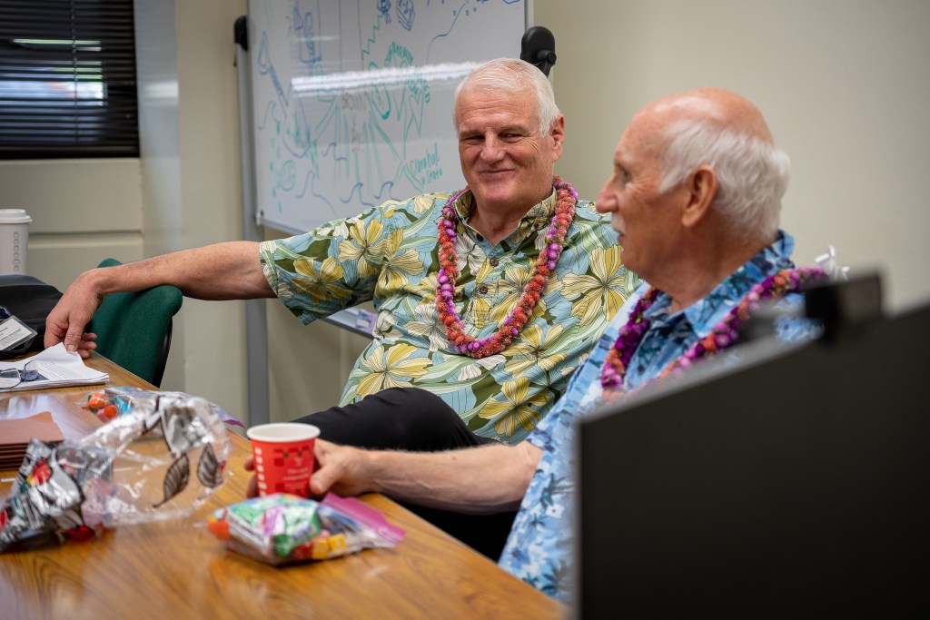 Retired Chief Justice Mark Recktenwald grins while speaking with retired law school Dean Avi Soifer during a seminar at the William S. Richardson School of Law April 30, 2026. (Craig Fujii/Civil Beat/2026)