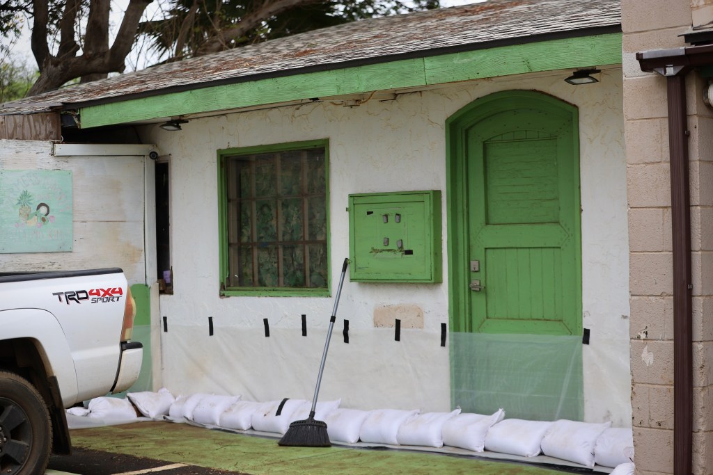 A home on South Kīhei road was prepared for flooding Thursday after cleaning up from March's back-to-back Kona low storms. (Erin Nolan/Civil Beat/2026)