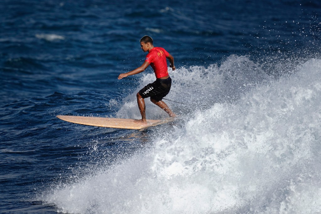 Micah Ah You of Kahuku High School competes in the inaugural Hawaiʻi High School Athletics Association surfing state championships boys longboard quarterfinals Saturday, May 2, 2026, at Hoʻokipa Beach Park in Pāʻia. Ah You finished second in the boys final. (Kevin Fujii/Civil Beat/2026)
