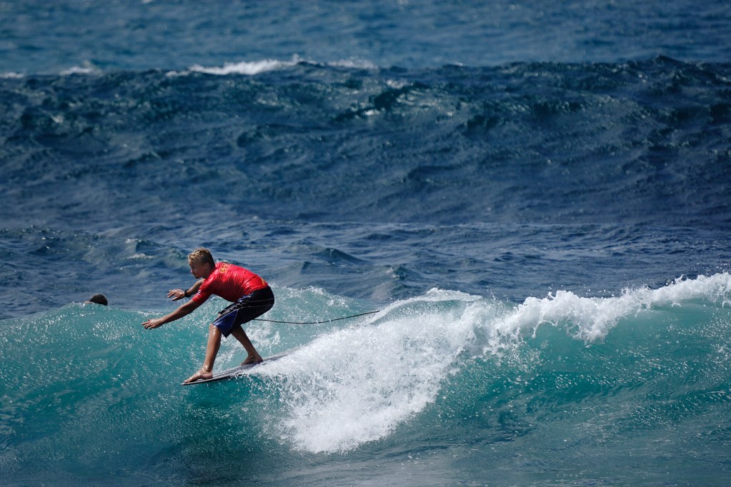 Maui’s Bode Davis of Kulanihakoi High School gets his toes on the nose of his longboard during the inaugural Hawaiʻi High School Athletics Association surfing state championships in the boys longboard final Saturday, May 2, 2026, at Hoʻokipa Beach Park in Pāʻia. Davis finished in fourth place. (Kevin Fujii/Civil Beat/2026)