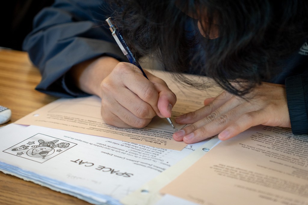A student at McKinley High School works on a comprehension problem using pencil and paper at McKinley High School May 1, 2026. (Craig Fujii/Civil Beat/2026)