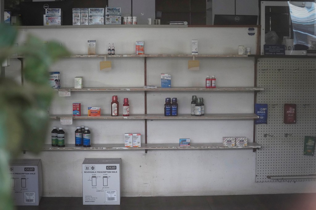 Kohala’s last drug store, Kamehameha Pharmacy, is photographed with doors locked, shelves relatively depleted and lights off Thursday, June 18, 2026, in Kapaʻau. The pharmacist of Hawaiʻi Island’s rural north shore drug store is retiring. (Kevin Fujii/Civil Beat/2026)