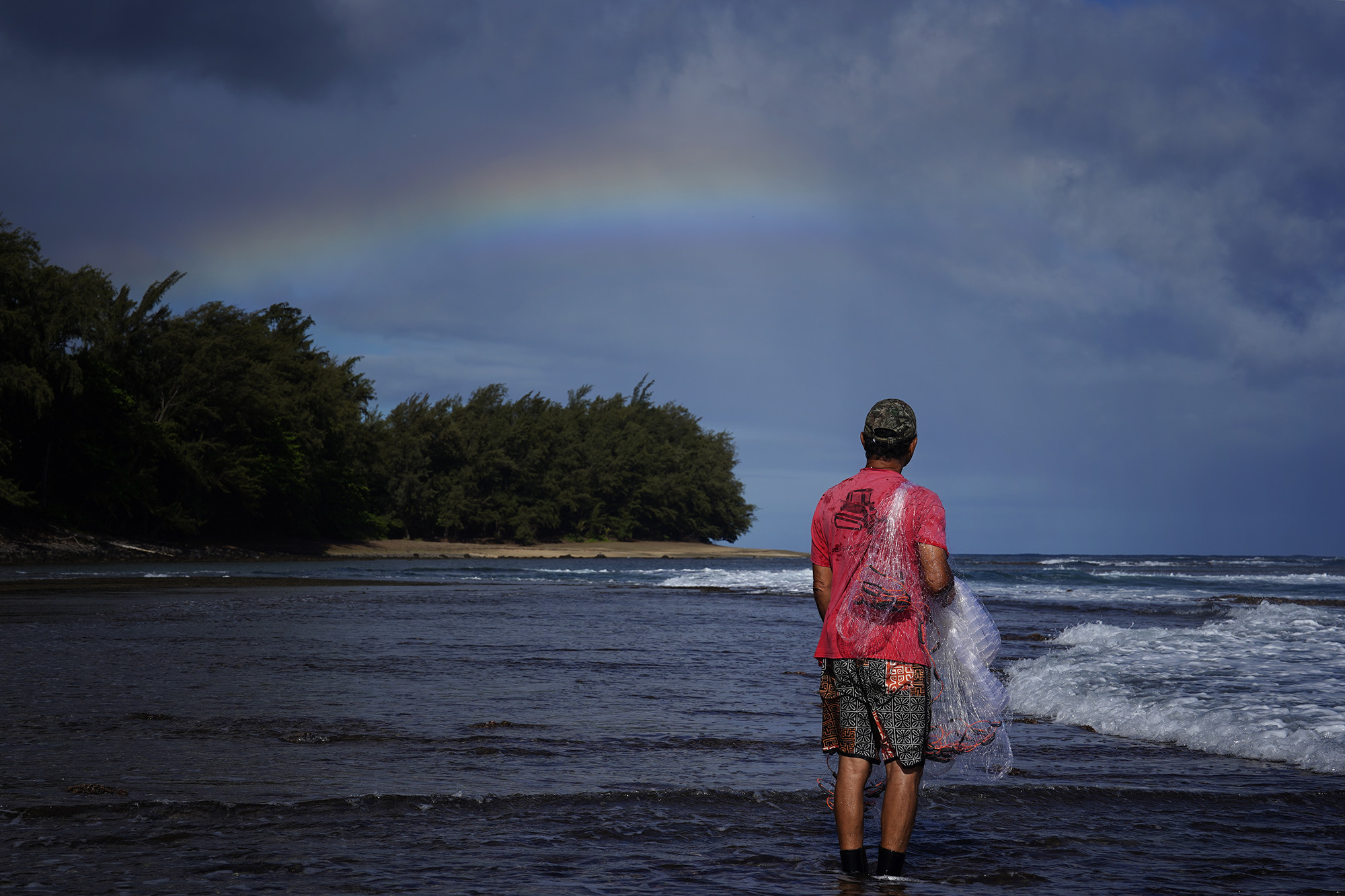 Keli‘i Alapa‘i scans below the surface of the Hāʻena community fishing waters Sunday, June 28, 2026, in Hāʻena.