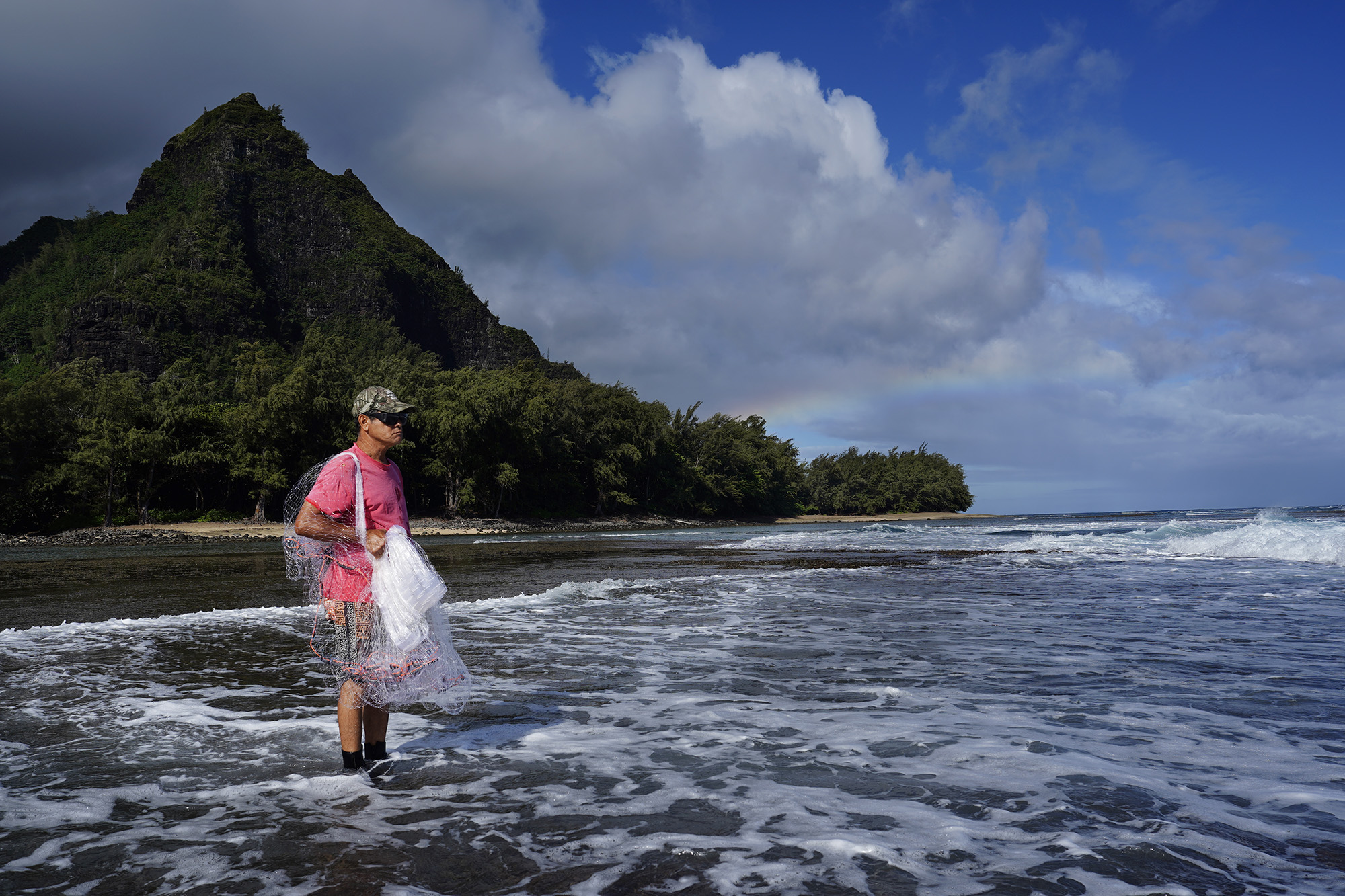 Keli‘i Alapa‘i scans below the surface of the Hāʻena community fishing waters Sunday, June 28, 2026, in Hāʻena.