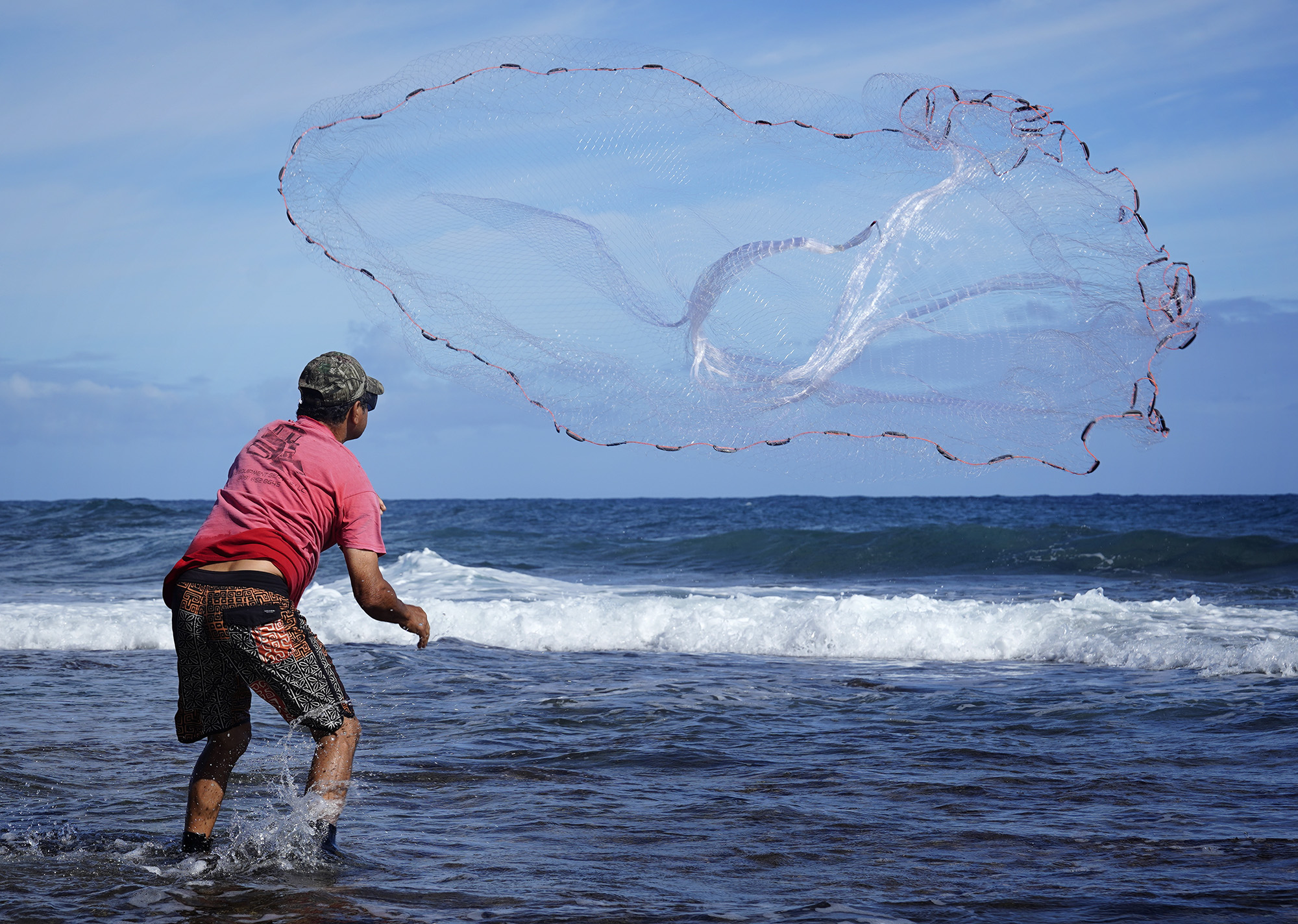 Keli‘i Alapa‘i throws his fishing net in Hāʻena community fishing waters Sunday, June 28, 2026, in Hāʻena.