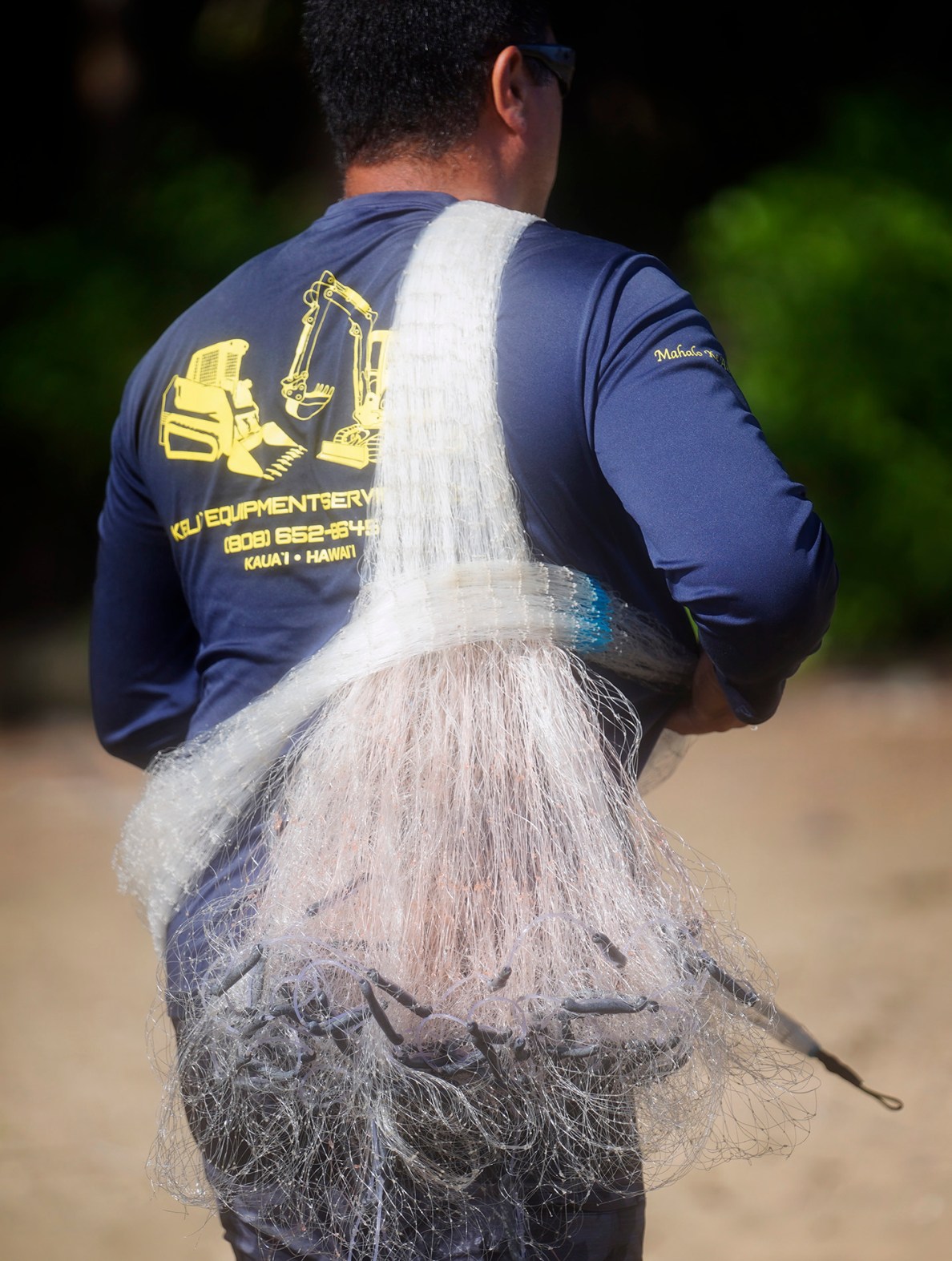 Kanoe Alapa‘i-Hashimoto’s fishing throw net is in neat order and ready to fly while wading in Hāʻena community fishing waters Sunday, June 28, 2026, in Hāʻena.