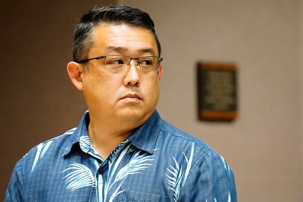 Dexter Kishida, left, and his attorney Addison Bonner listen to Judge Ronald Johnson during his arraignment Monday, June 29, 2026, in Honolulu. Kishida is a former Honolulu government employee accused of defrauding the Hawaiʻi Foodbank during the COVID pandemic. His attorney (Kevin Fujii/Civil Beat/2026)