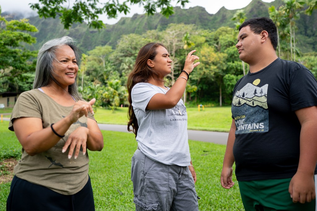 Nikki Kepo'o, left, with her daughter Rebekah Pualokomaika'i Kepo'o, 17, and son Caleb La'aikeakua Kepo'o at Ho'omaluhia Botanical Gardens in Kāneʻohe June 15, 2026. (Craig Fujii/Civil Beat/2026)