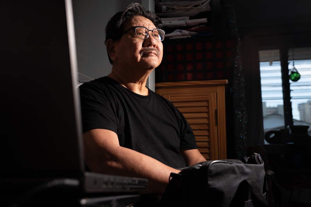 Bradford Yamamoto says Catholic Charities owes money for damages to a rental unit he owns in Nānākuli. He was photographed at his rented home in Honolulu June 18, 2026. (Craig Fujii/Civil Beat/2026)
