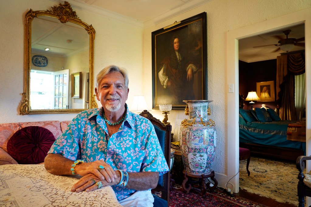 Robert Fox is photographed in his historic home Monday, July 27, 2026, in Honolulu. The City and County of Honolulu offers a tax break for owners of historically designated homes. The painting behind Fox is a 1725 portrait of his forefather Johann Ernst Von Fuchs. (Kevin Fujii/Civil Beat/2026)