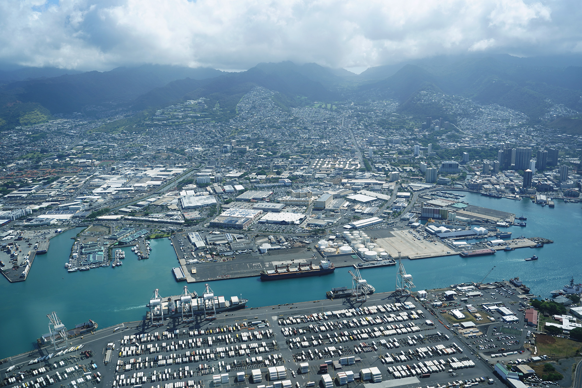 Honolulu Harbor is photographed from a commuter airplane Thursday, July 30, 2026, over Honolulu. Sand Island lies at the bottom of the image. (Kevin Fujii/Civil Beat/2026)