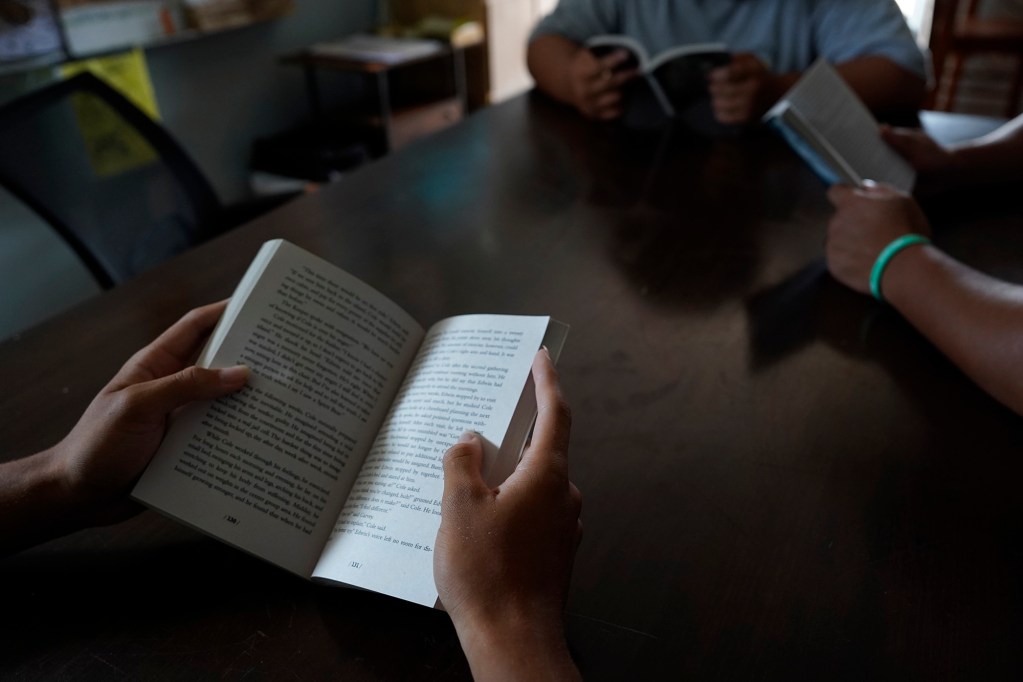 Students pretend to read books for a photo Friday, July 31, 2026, in Kapolei. One in 10 students need to repeat their freshman year of high school in Hawaiʻi. (Kevin Fujii/Civil Beat/2026)