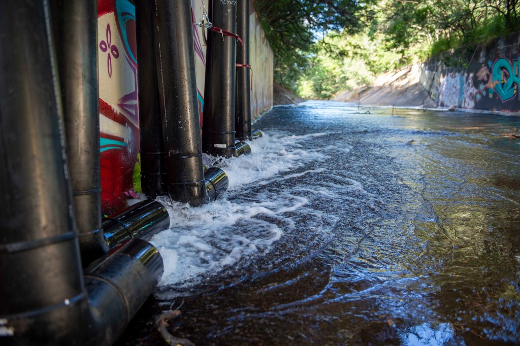 AIEA, Hawaii (Jan. 30, 2022) – Red Hill Well water, filtered through granular activated carbon filters, is discharged at 80% capability into the Halawa Stream. The Interagency Drinking Water System Team is a joint initiative where the U.S. Navy is working closely with the Hawaii Department of Health, U.S. Environmental Protection Agency and the U.S. Army to restore safe drinking water to Joint Base Pearl Harbor-Hickam housing communities through sampling and flushing, and the recovery of the Red Hill Well. For detailed information, go to: www.navy.mil/jointbasewater.  (U.S. Navy photo by Mass Communication Specialist 1st Class Luke McCall)