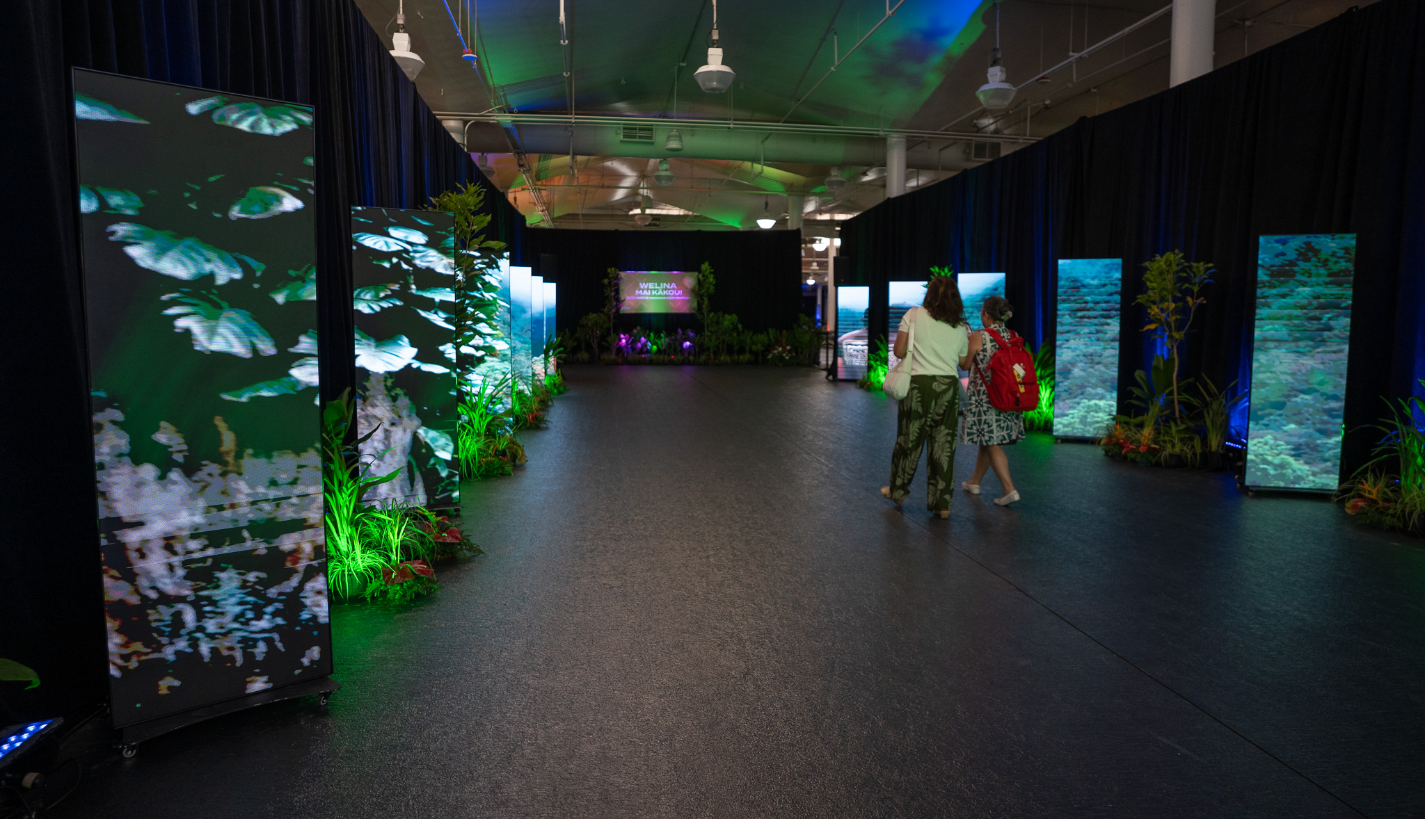 Video panels greet visitors to the 2026 Native Hawaiʻian Convention at Blaisdell Center July 21, 2026. (Craig Fujii/Civil Beat/2026)