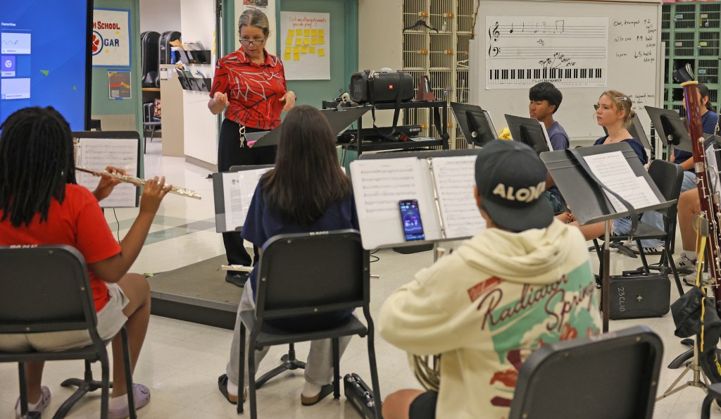 Music teacher Lisa Wells conducts students during a summer school band class Tuesday at Keaʻau High School. The program is part of the school's summer transition activities designed to help incoming freshmen prepare for the upcoming school year. Photo by Tim Wright