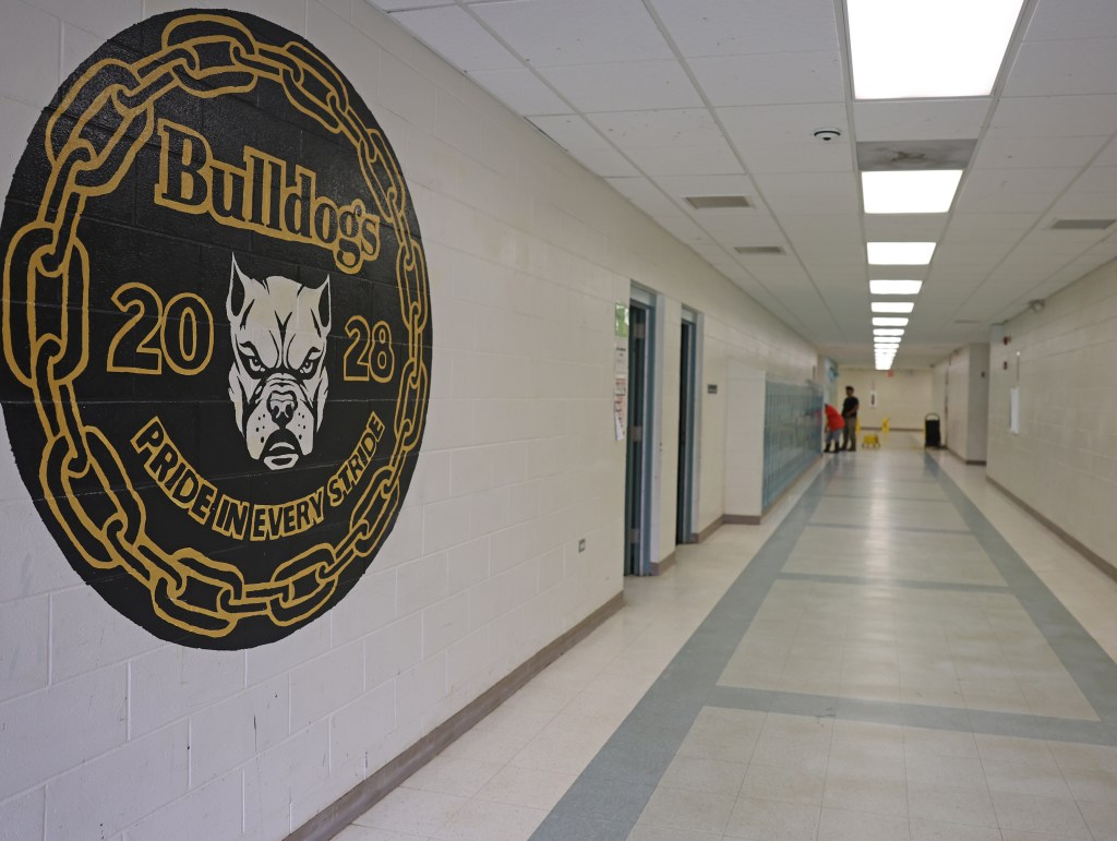 Student workers strip floors in preparation for waxing Tuesday at Keaʻau High School. Summer maintenance projects are underway across campus ahead of the new school year. Photo by Tim Wright