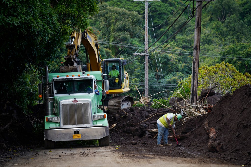 Workers clear Hi-11 as the town of Nāʻālehu continues to recover Tuesday, Aug. 18, 2026, on Hawaiʻi Island. Hurricane Lala made a close pass to the South Point of the Big Island Saturday. (Kevin Fujii/Civil Beat/2026)