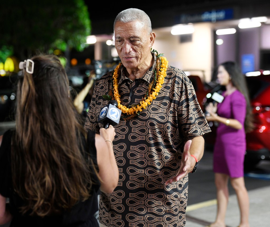 Maui County Mayor Richard Bissen meets with media members Saturday night outside the Akaku Maui Community Television studios.