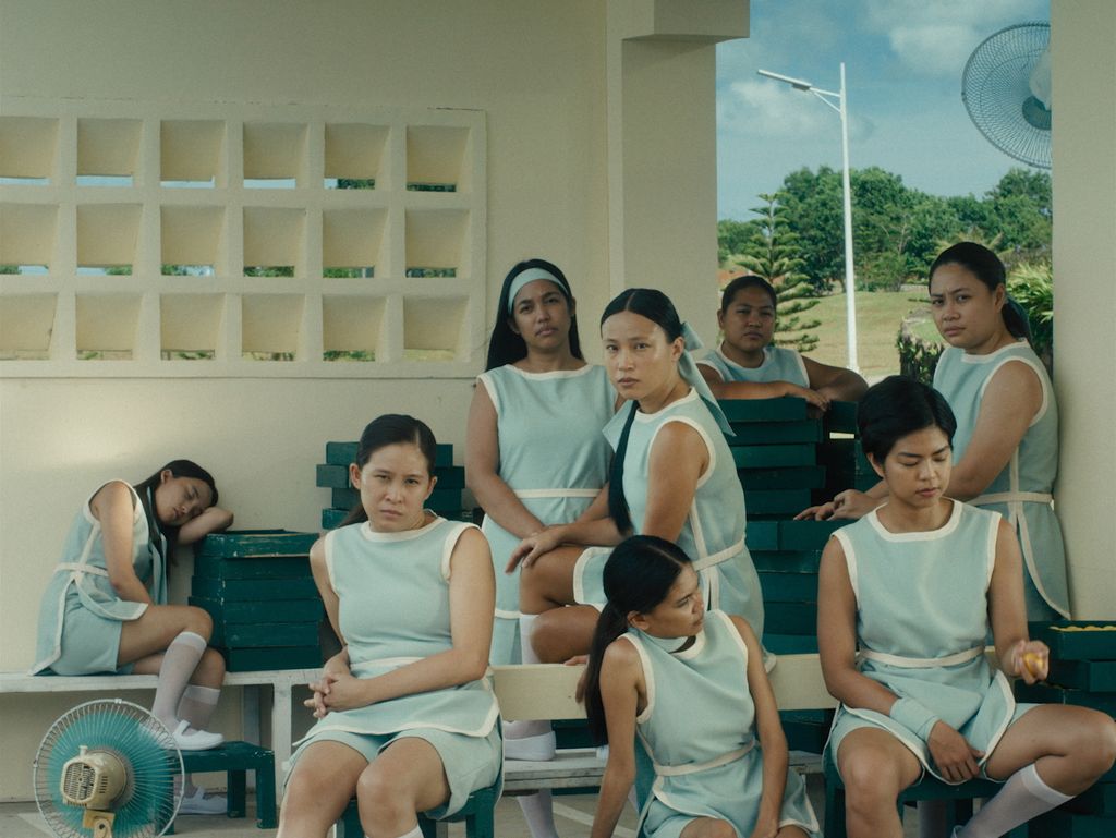 A group of girls who work at a country club golf course