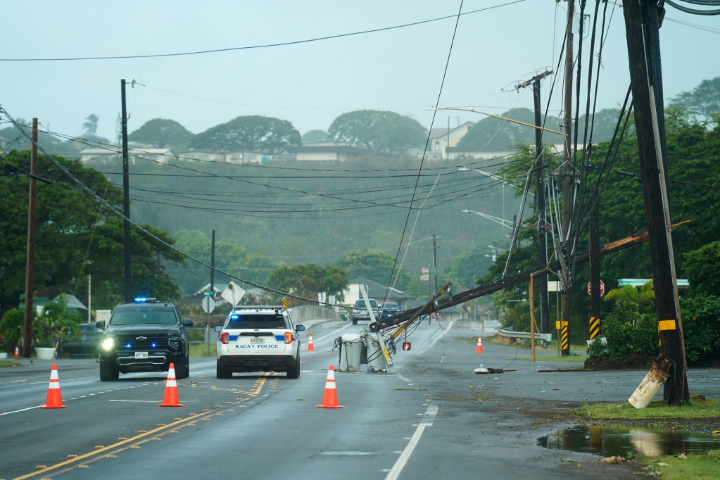 Kauaʻi Police block Kaumualiʻi Highway because of a downed utility pole from Hurricane Lowell Tuesday, Sept. 8, 2026, in Hanapēpē. (Kevin Fujii/Civil Beat/2026)