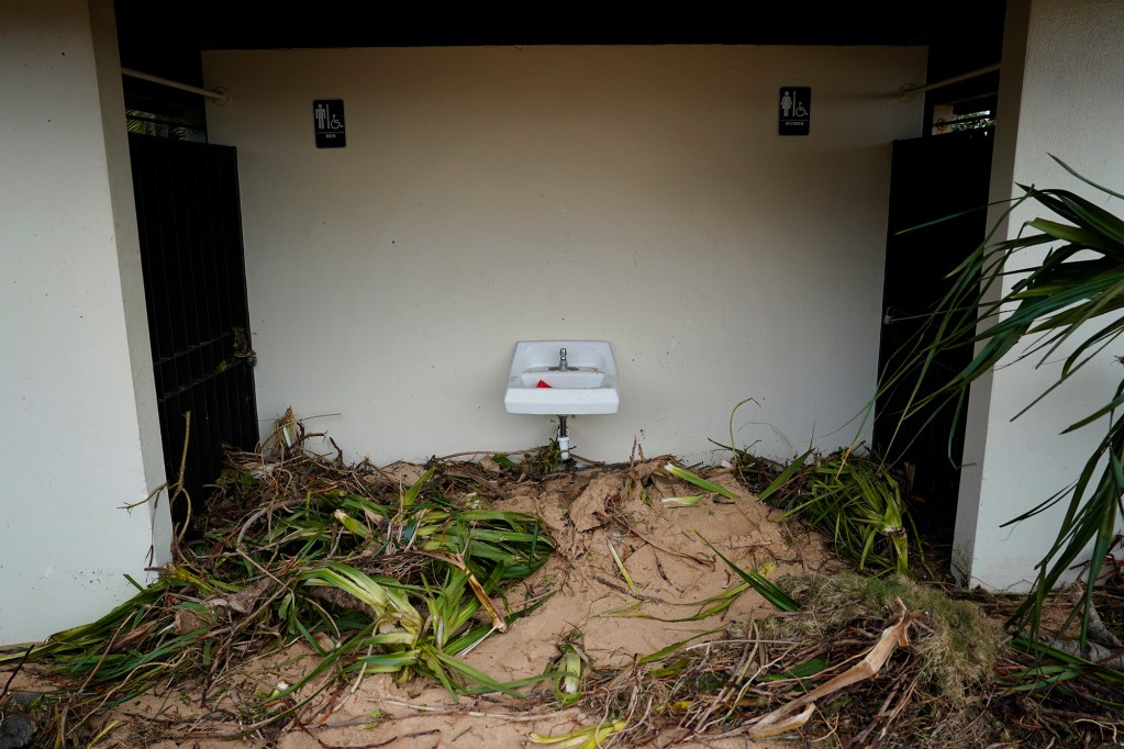 Sand fills the public restroom at Kaihuna Beach Tuesday, Sept. 8, 2026, in Poʻipū. (Kevin Fujii/Civil Beat/2026)