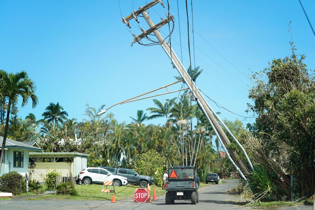 A utility pole leans over Aku Road, makai of Kūhiō Highway, Wednesday, Sept. 9, 2026, in Hanalei. (Kevin Fujii/Civil Beat/2026)