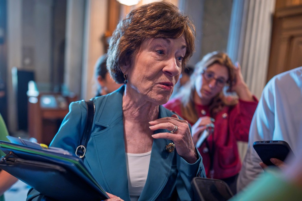 Sen. Susan Collins, R-Maine, responds to reporters asking about the shooting by an ICE officer that killed a Colombian driver Monday in Maine, at the Capitol in Washington, Tuesday, July 14, 2026. (AP Photo/J. Scott Applewhite)