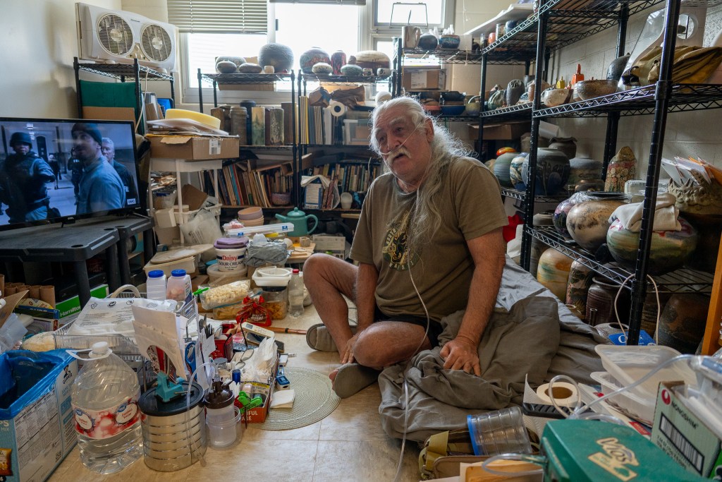 Steven Shoemaker, a potter, in his 7th floor apartment Sept. 2, 2026. Emergency workers carried him down seven floors August 24th because the building elevator has been out of service. Shoemaker is debilitated by obstructive lung disease and uses supplemental oxygen continuously. (Craig Fujii/Civil Beat/2026)