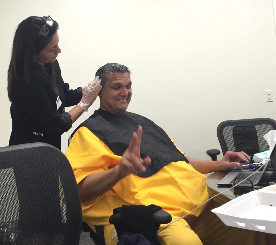 A paralegal dyes Leonard Francis’s hair while he prepares for a debriefing by federal agents.
