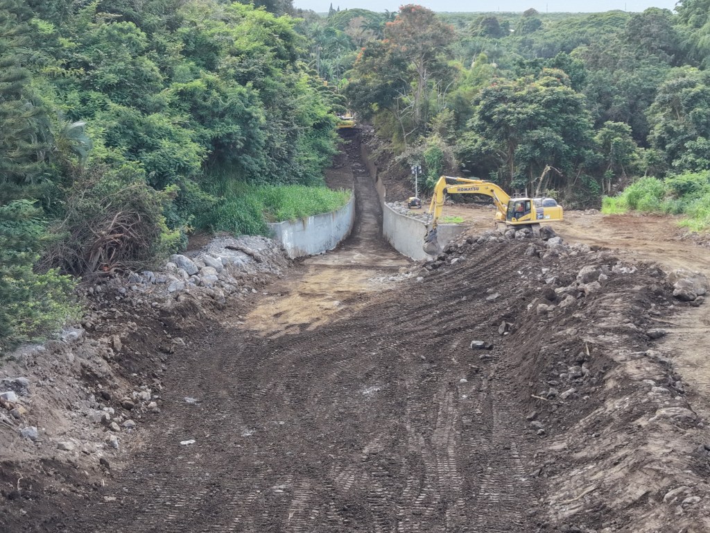 A county crew clears the Waiohinu flood channel in Kaʻū on the Big Island Wednesday (9/23) ahead of the arrival of Hurricane Nolo.