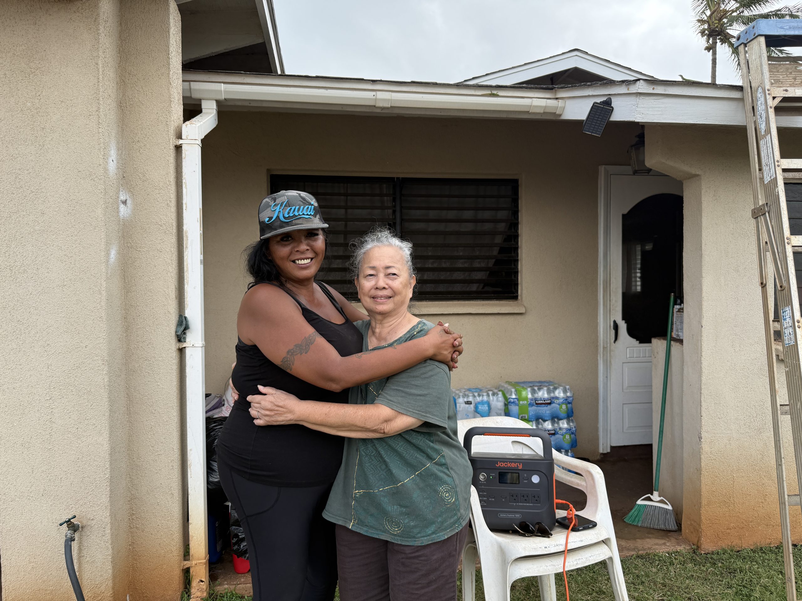 Rosie, left, and Rose Largo had just finished cleaning up debris in their yard late Tuesday afternoon in Kekaha after making multiple runs to the landfill. (Noelle Fujii-Oride/Civil Beat/2026)