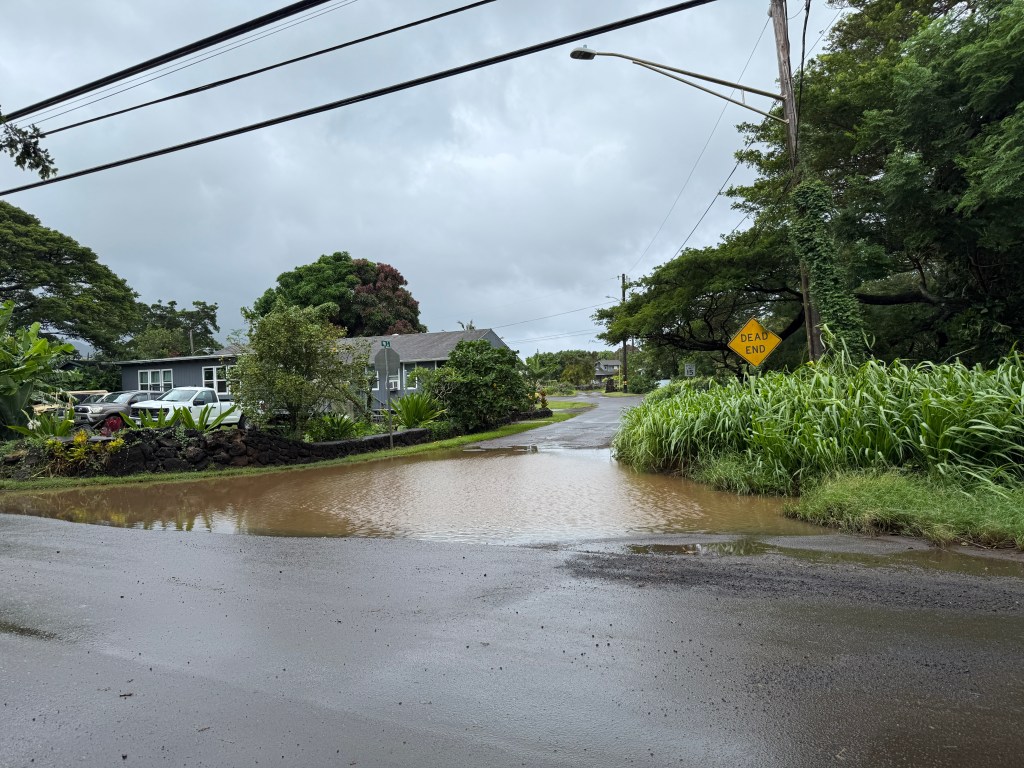 Water ponds at the intersection of Puni and Waikomo roads in Kōloa ahead of Hurricane Lowell.