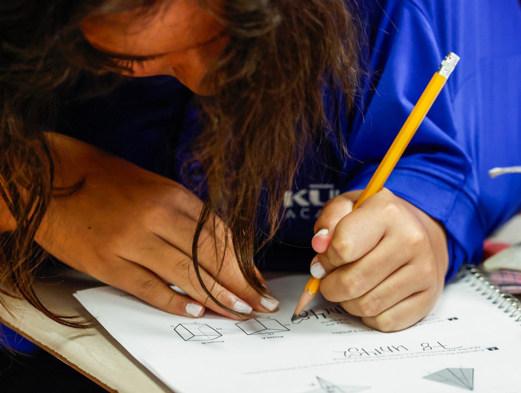 Sixth-grader Angelica Meikei solves a math problem at Kūlia Academy, Wednesday, Sept. 30, 2026, in Kalihi. Kūlia Academy’s middle school math achievement has had unprecedented improvement, and had the highest middle school math scores in the state last year. (Jamm Aquino/Civil Beat/2026)