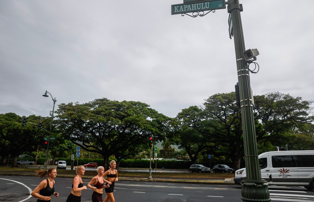 A traffic camera/license plate reader camera is seen on a stoplight post at the intersection of Kapahulu Avenue and Kūhiō Avenue, Wednesday, Sept. 30, 2026, in Waikīkī. (Jamm Aquino/Civil Beat/2026)