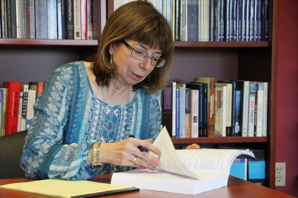 In this Tuesday, July 3, 2018 photo, Margaret Stock, an Alaska-based immigration attorney and a retired Army Reserve lieutenant colonel who helped create the immigrant recruitment program, poses for a photo at her office in Anchorage, Alaska. The U.S. Army has moved in recent weeks to discharge some immigrant recruits and reservists who enlisted through a program that promised them a path to citizenship. Stock said she's been inundated over the past several days by recruits who report being abruptly discharged. (AP Photo/Mark Thiessen)