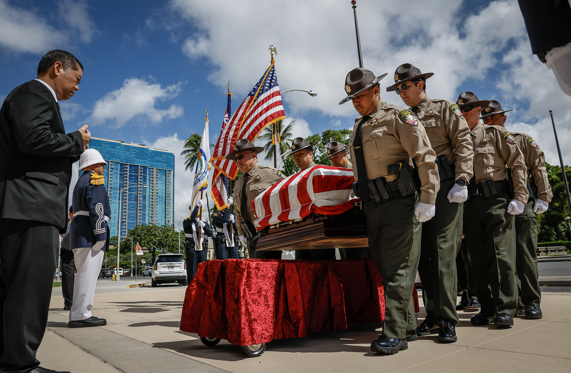 Hawaiʻi State Sheriff’s deputies carry the casket of former Hawaiʻi Governor George Ariyoshi, Friday, Sept. 18, 2026, in Honolulu. Ariyoshi’s casket will lie in state at the State Capitol rotunda through Saturday.  (Jamm Aquino/Civil Beat/2026)