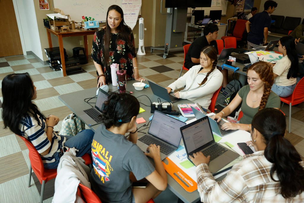 Nalukai facilitator Sara La Torre, top, works with Hawaiʻi Island teens Thursday, Oct. 8, 2026, in Hilo. They spend the week learning how to identify and solve problems in their communities. (Kevin Fujii/Civil Beat/2026)